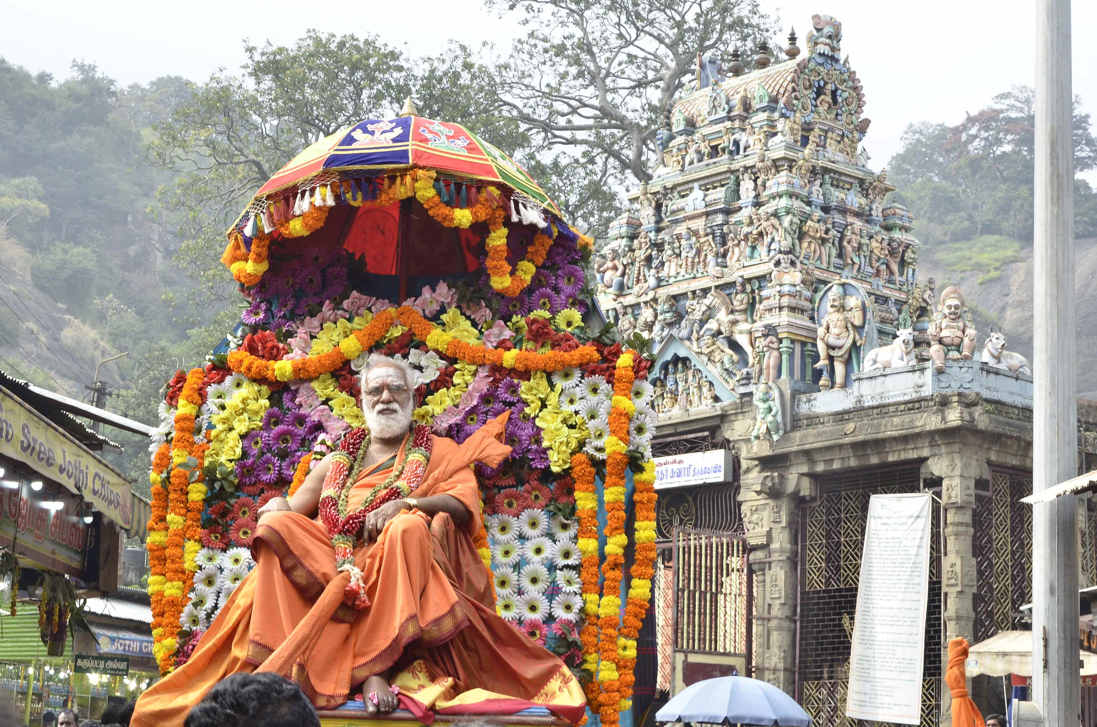 Procession at Sri Siddheswari Peetham with Swamiji seated on a floral palanquin